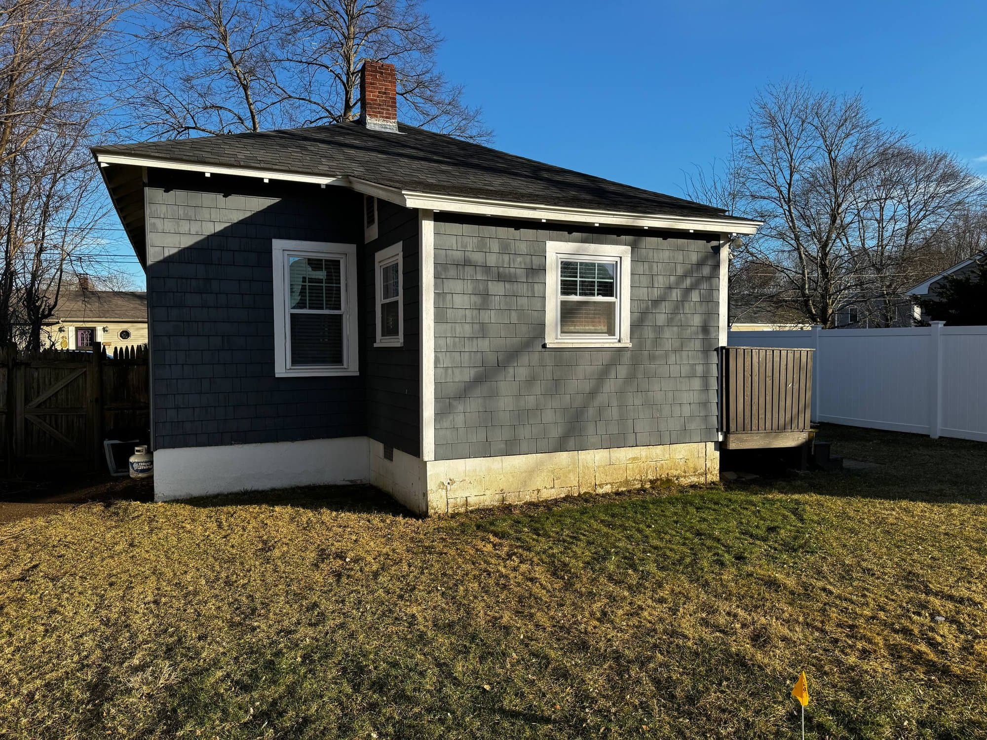 Original rear of the cottage with a small existing landing before the deck build