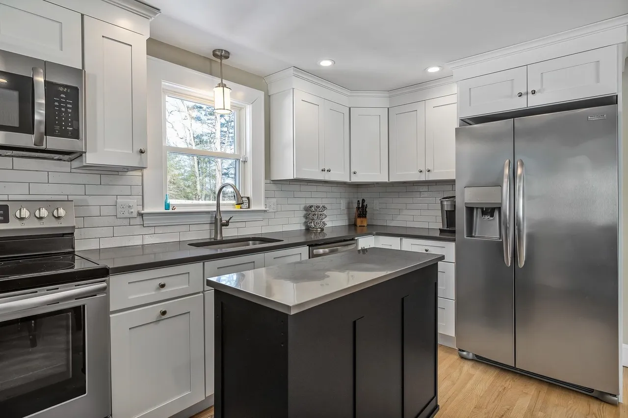 Original kitchen showing the previous subway-tile backsplash before the hex-tile refresh