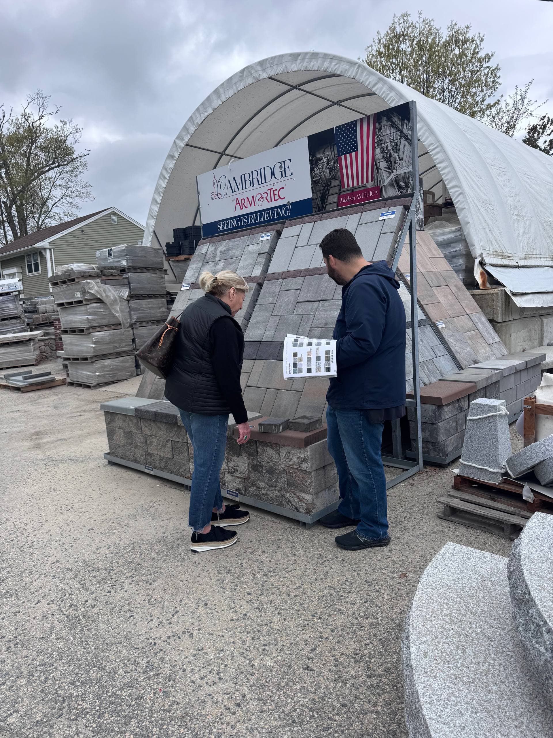 Kevin, J&M Contracting co-owner, walking a homeowner through Cambridge paver color options