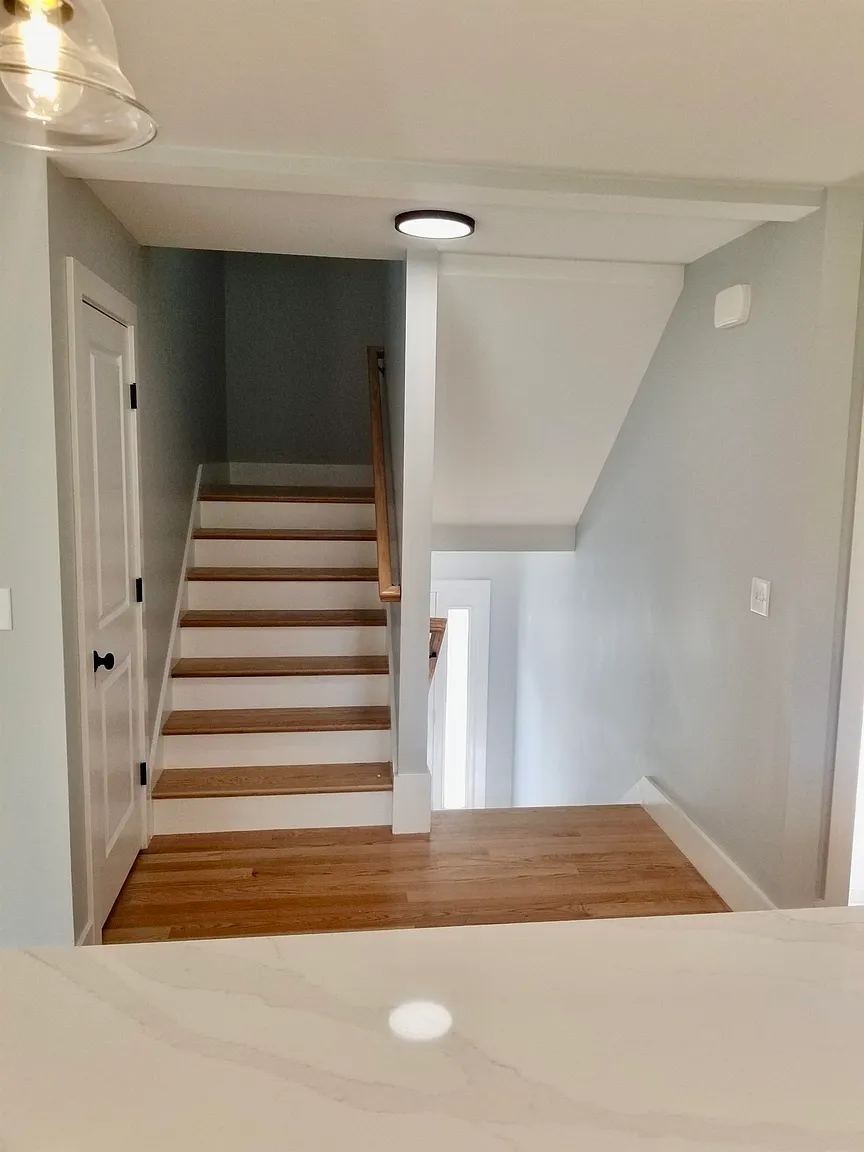 Hardwood staircase to second floor
