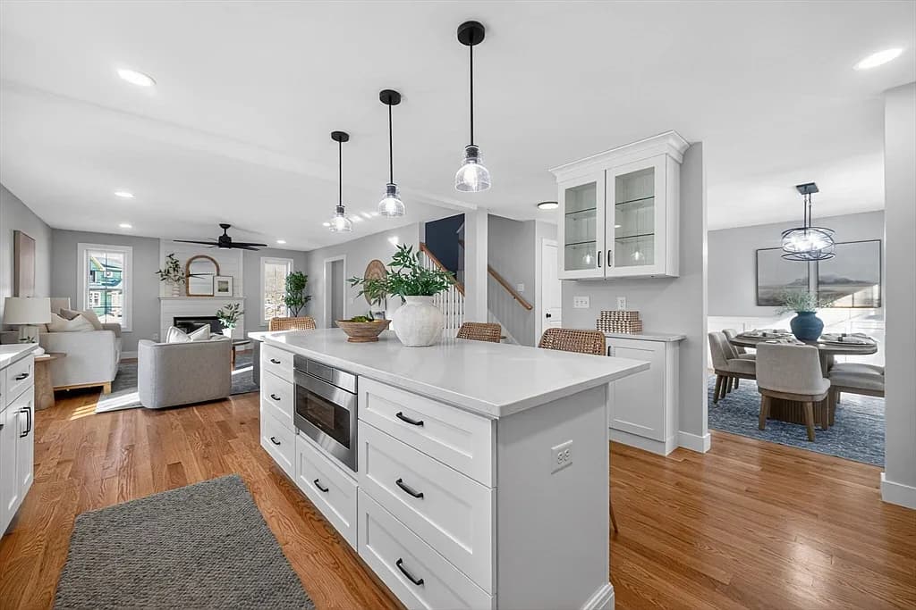 Open-concept kitchen looking through to family room and dining area